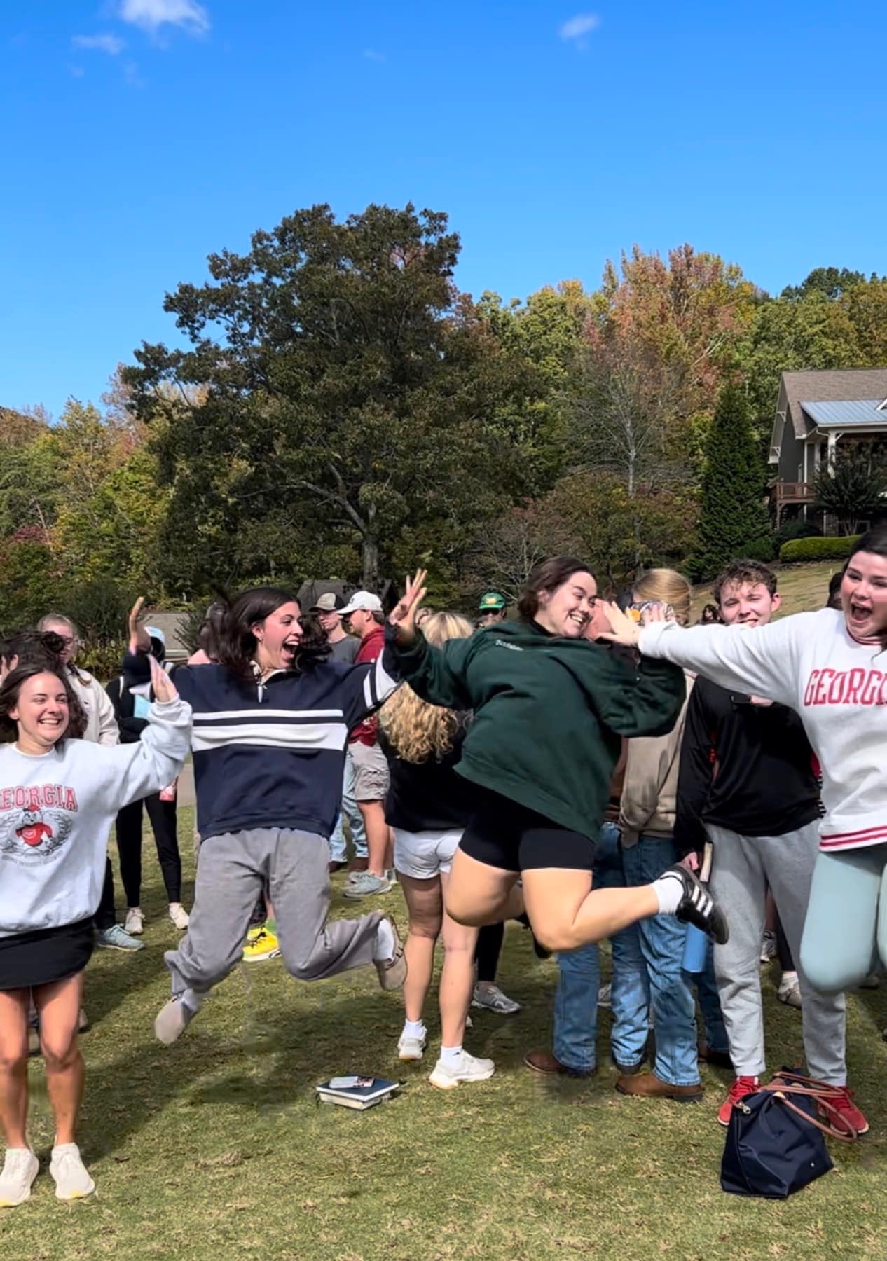 RUF students celebrating together outdoors at Fall Conference