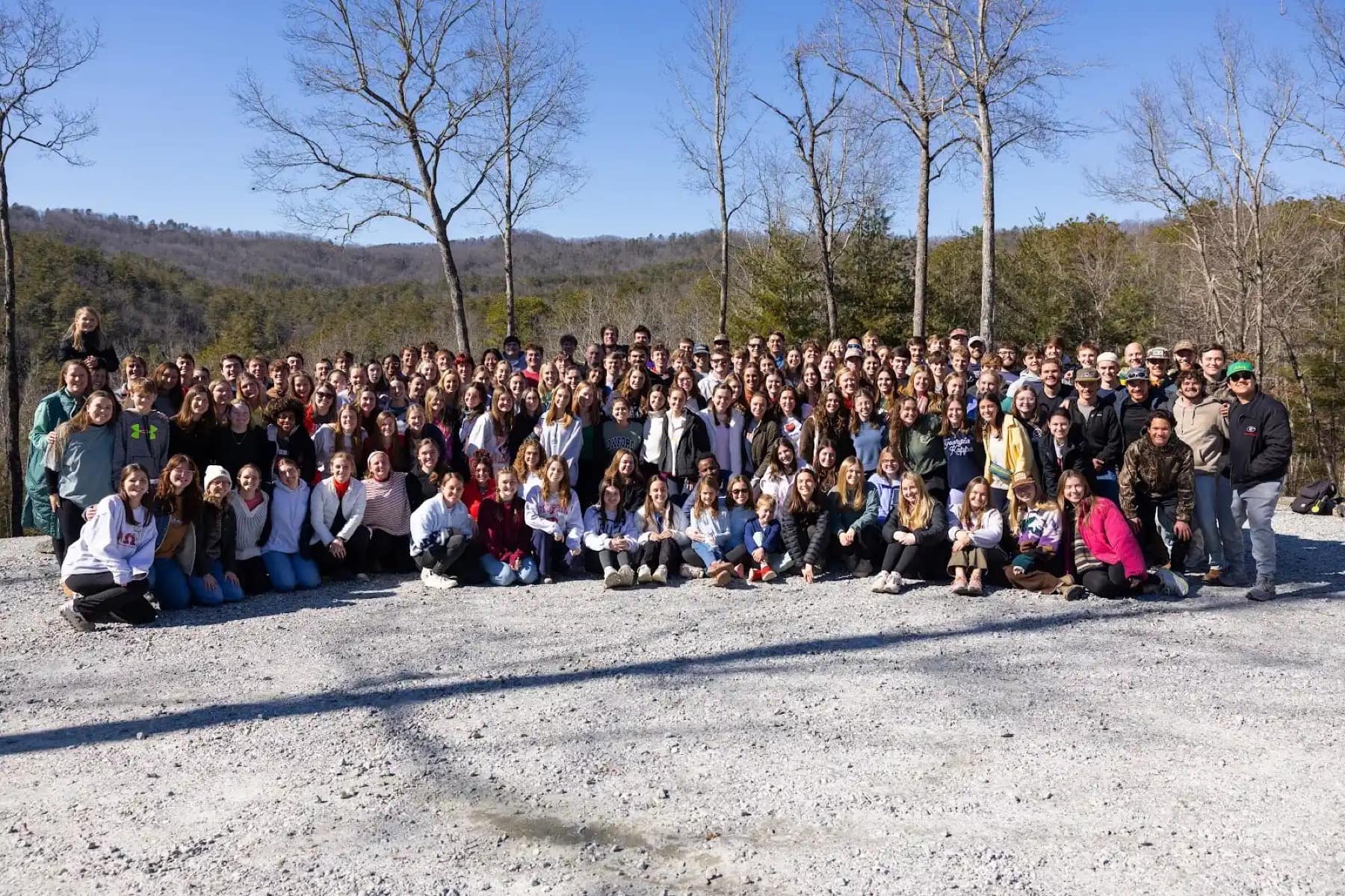 The Winter Retreat group smiling together in the mountains