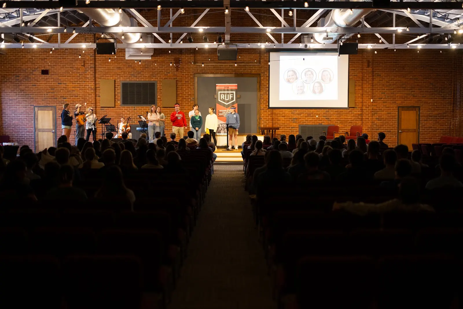 Students gathered around the stage for teaching at Large Group