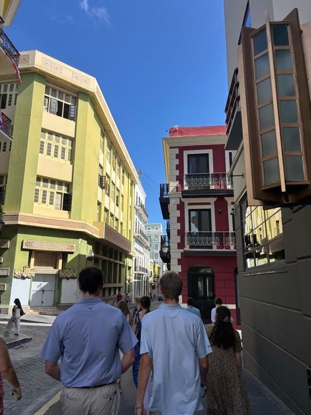 Students walking together through a colorful Puerto Rico street