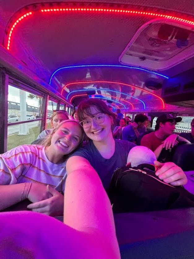 Friends riding together on the mission trip bus