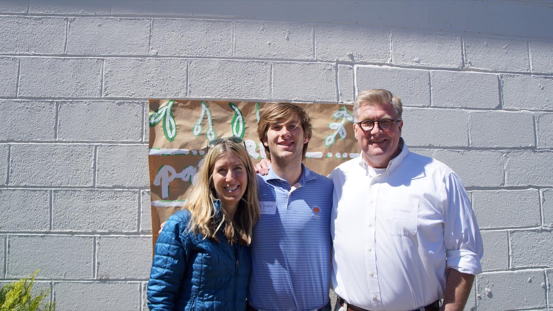 A RUF student standing with family members at Parents Lunch