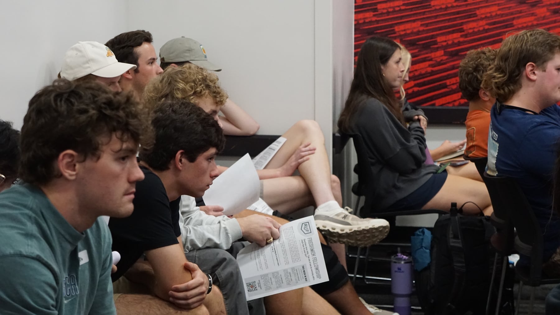 Freshmen listening and talking in a small group