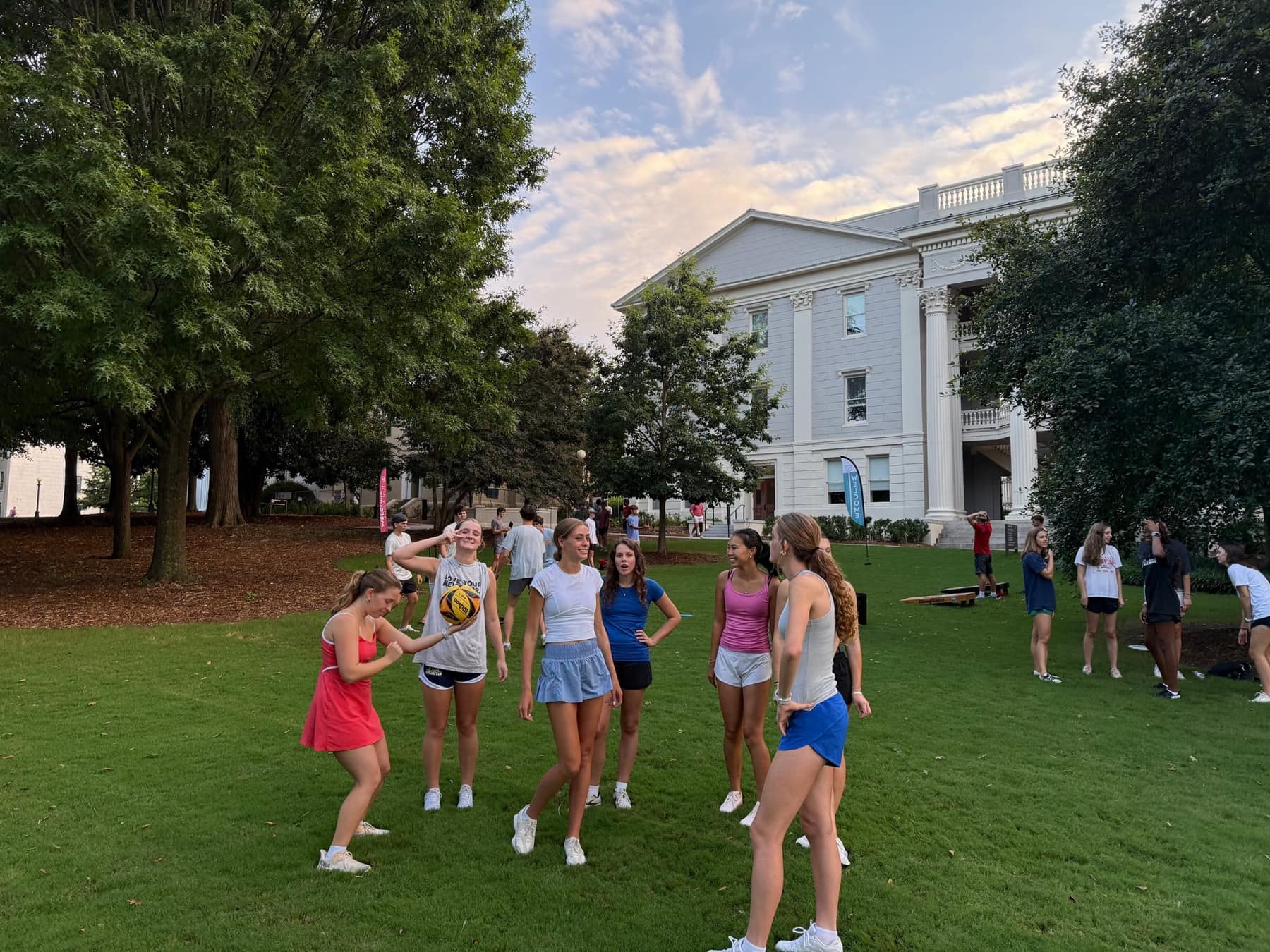 New UGA students laughing and playing lawn games on North Campus Lawn