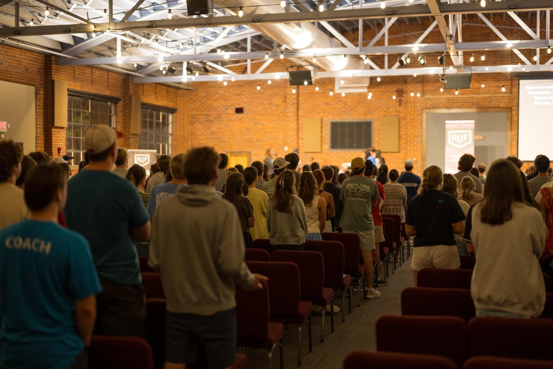 RUF at UGA students worshiping together in a full room